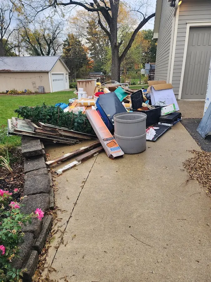 Dumpster being loaded with debris for 3 Yard Dumpster Rental in Ashland